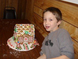 Skyler with his gingerbread house